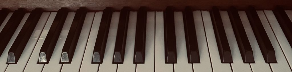 Piano and moleskin notebook